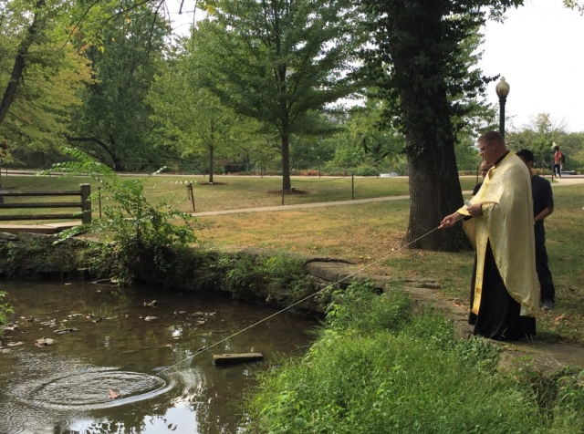 Father pulls the cross back in