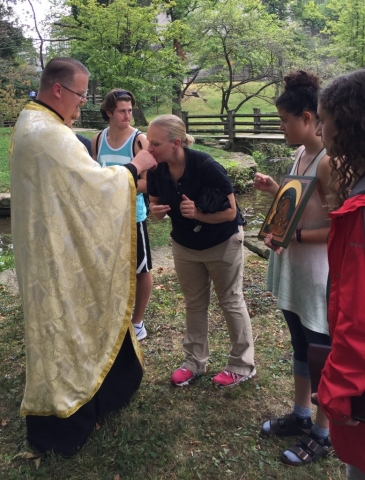 Venerating the cross and Fr. Peter's hand at the conclusion of the service